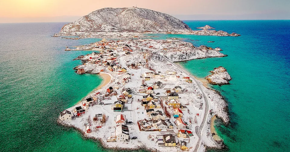 Snowy islands and a fishing village seen from above near Tromsø